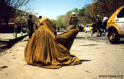 Thousands of Afghan war-widows had no other option but to beg to save their children from hunger. Taliban floged these ill-fated women in the streets because most of them had to leave their houses without a Mahram. Photo: RAWA www.rawa.org
